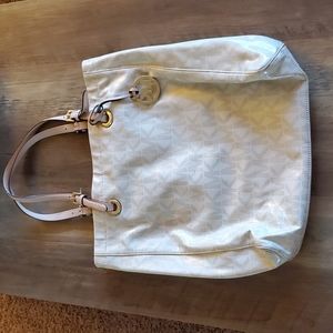 Michael Kors large purse. Some wear and tear.